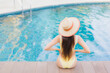 © siraphol - Portrait beautiful young asian woman relax smile leisure around outdoor swimming pool