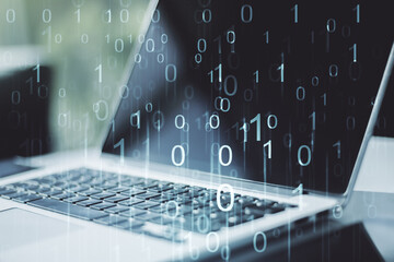 Creative concept of binary code illustration on modern laptop background. Big data and coding concept. Multiexposure