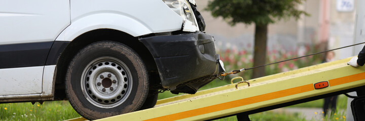 Wrecked car drives into tow truck. Service evacuation concep