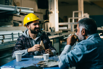 industrial workers having lunch break