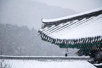 Beautiful wind bell in Korea and snow covered trees
