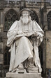 Statue of writer and theologian Richard Hooker next to Exeter Cathedral, Devon UK