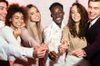 © Prostock-studio - Happy Friends Holding Burning Sparklers Celebrating New Year At Home