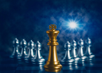 Wall Mural - Golden king chess is surrounded by falling around silver chess pieces  to fighting with teamwork to victory, business strategy concept and leader and teamwork concept for success.