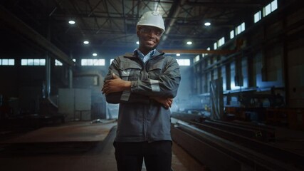 Aufkleber - Happy Professional Heavy Industry Engineer/Worker Wearing Uniform, Glasses and Hard Hat in a Steel Factory. Smiling African American Industrial Specialist Standing in a Metal Construction Manufacture.