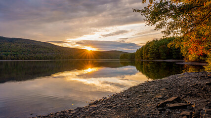 Roundout Resevoir in Catskill mountains of New York in sunset time. Colorful trees and calm lake