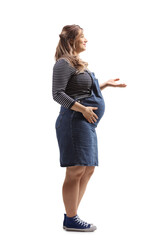 Canvas Print - Full length profile shot of a young pregnant woman gesturing with hand