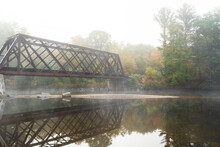 Moody Abandoned Train Bridge Over The Pemi River In New Hampshire. Fall Foliage Leaves Changing, Misty River In The Morning Bg