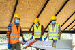 © visoot - Group of Worker man wearing hygienic mask and protective hard hat working at construction site,Safety concept.