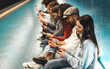 © Alessandro Biascioli - Young people using mobile smartphone while sitting in subway waiting train - Youth millennial addicted to new technology concept