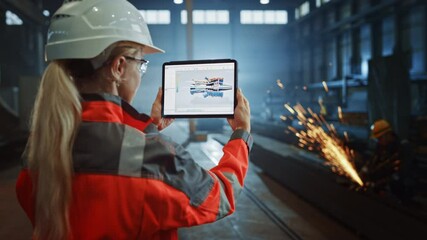Wall Mural - Professional Heavy Industry Engineer Uses Tablet Computer for Augmented Reality Render with Interactive Turbine Engine Blueprint