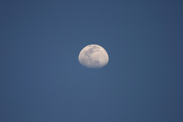 the moon at dark blue sky