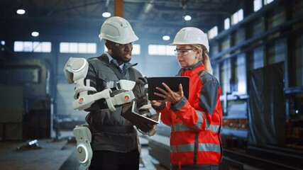 Poster - Futuristic Concept of a Manual Labor Worker in a Bionic Exoskeleton Prototype Working in a Factory. Heavy Industry Engineer Monitors the Powered Suit on an African American Assistant.