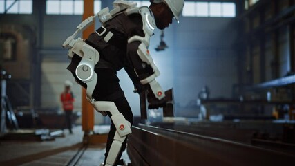 Poster - Black African American Engineer is Testing a Futuristic Bionic Exoskeleton and Picking Up Metal Objects in a Heavy Steel Industry Factory