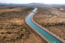 Irrigation Canal Winding Thru The Arizona Desert
