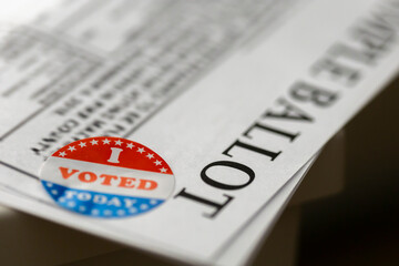 macro of i voted sticker on a sample ballot