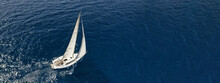 Aerial Drone Ultra Wide Photo Of Sailboat Cruising Deep Blue Sea