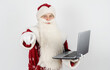 © Dzmitry - Santa Claus sits at his desk and works at the computer.