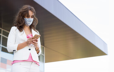 girl with mobile and mask