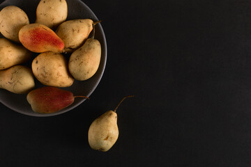 Wall Mural - Fresh juicy appetizing pears on a gray plate, summer concept, copy space.