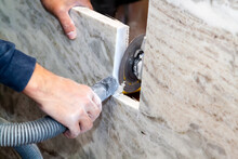 Artisan Cuts Edges In Marble Kitchen Countertop With Hand Circular Saw