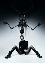Dark Woman With Skull Face And Black Skeleton