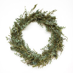 Wall Mural - Round wreath frame made of fir and eucalyptus branches on white background. Christmas / New Year celebration decoration. Holiday concept.