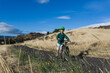 © Cavan Images - A young boy rides his bike with his mom in the Columbia Gorge.