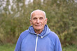 © Bonsales - portrait of old bald grey haired man greenery background outdoor