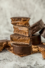 Homemade chocolate alfajores, typical of Argentina, marble background with copy space