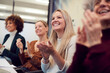 © Monkey Business - Line Of Businesswomen In Modern Office Applauding Presentation By Colleague