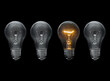 © unclepodger - A few light bulbs on black background
