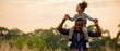 © Tawan - Enjoy togeter African Father with daughter on back at park