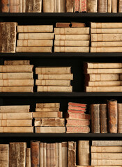 Wall Mural - antique books on old wooden shelf.