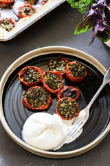 Wall Mural - Provencal Tomatoes. Baked Tomatoes with parsley, garlic and olive oil served with burrata cheese