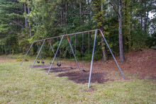 Empty Playground Swing Set At The Park