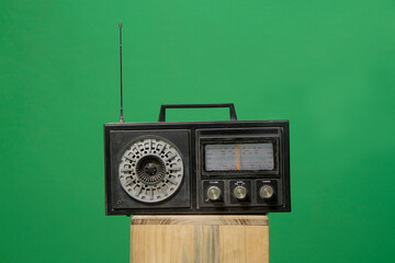 retro vintage old radio isolated on green background