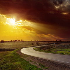 Poster - dramatic orange sunset over road