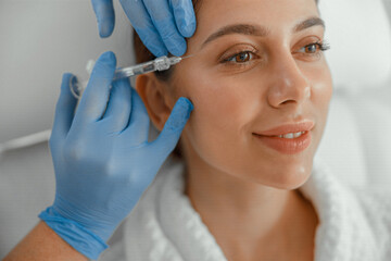 Beautiful healthy smiling caucasian woman is doing beauty procedures at spa and healthcare salon