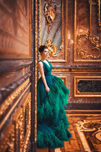 Portrait Of A Beautiful Young Girl In A Haute Couture Green Dress.
