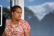 © Caro Telfer/Austockphoto - lady leaving building outside the door