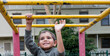 © Gary Radler/Austockphoto - Preschool Aged Aboriginal Boy on Playground Equipment