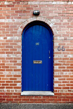 Blue Arched Door With Number 66
