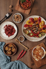 Wall Mural - dishes and snacks of traditional Caucasian Georgian cuisine. classic national serving on a rustic wooden table