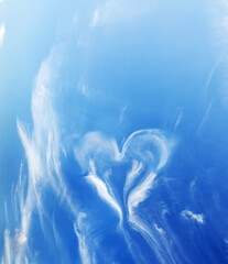 Canvas Print - Heart shaped cloud on blue sunny sky.