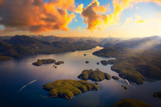 Beautiful aerial view of the west coast on Vancouver Island. Picture taken in Bligh Island Marine Provincial Park, BC, Canada. Sunset or Sunrise Sky Artistic Render