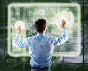 Wall Mural - businessman working with virtual technologies