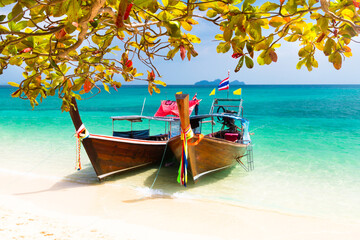 Wall Mural - Wooden boats on a tropical beach.