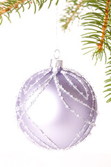 Canvas Print - Christmas ball hanging from a branch of a fir tree