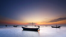 Silhouette Of Small Fishing Boats At The Sunset, Thailand